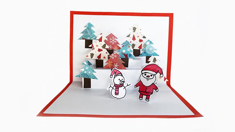 涂上颜色并剪下来将圣诞树圣诞老人和雪人粘贴在贺卡上漂亮的圣诞